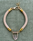 Babi Smoky Quartz pendant on golden cord. Statement necklace by Dorow Collection