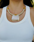 Detail view of Luckie calcite statement necklace on model